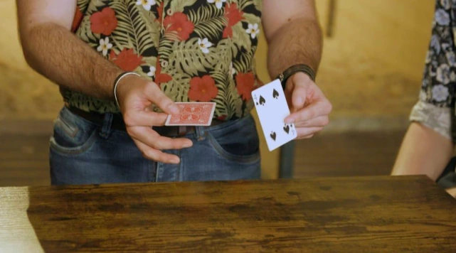 Magician using presentation and misdirection to create a sense of wonder